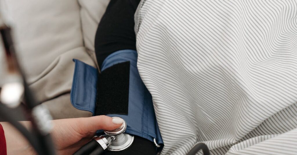 A patient getting her blood pressure checked while resting at home.