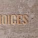 Wooden letters spelling 'choices' on a textured surface, symbolizing decision-making.