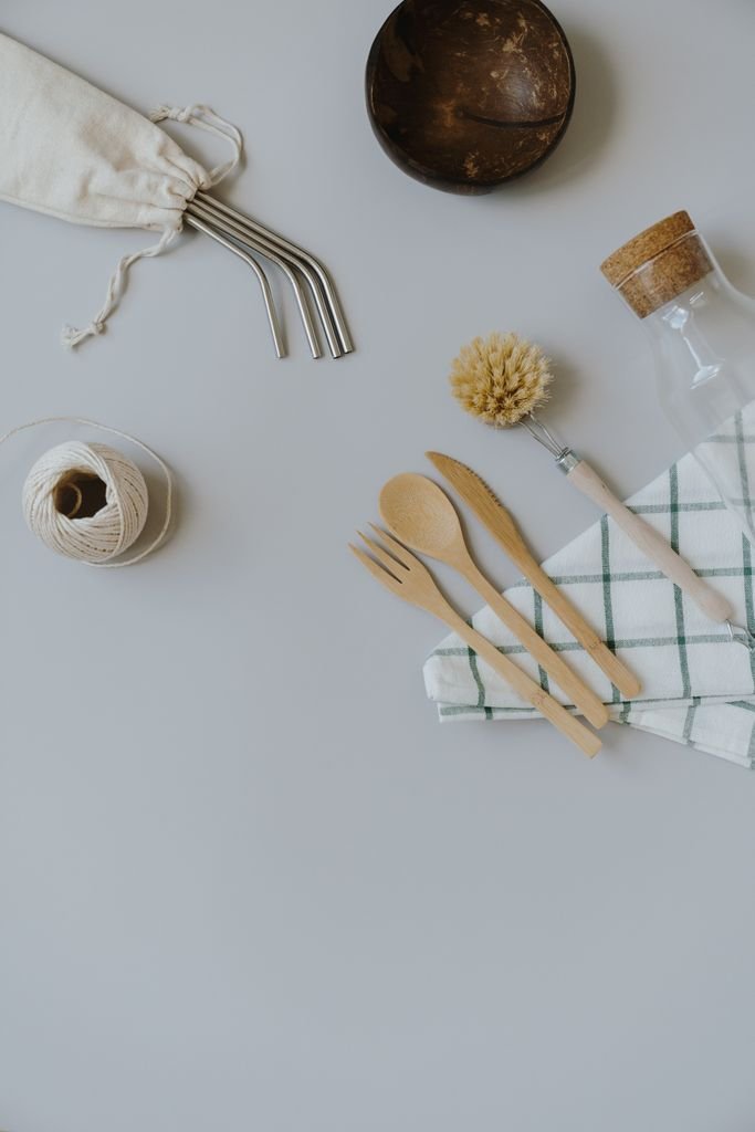A flat lay of eco-friendly kitchen utensils with a natural aesthetic.